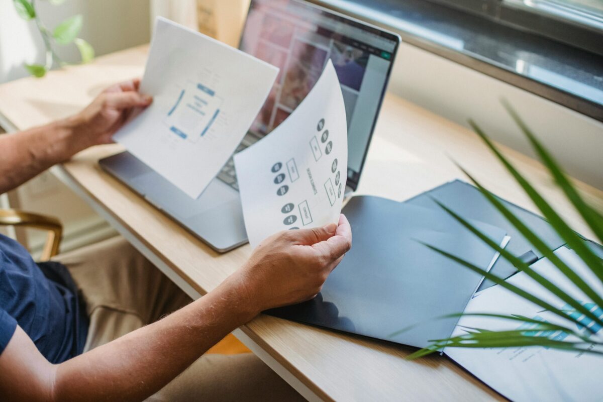 Laptop and papers.