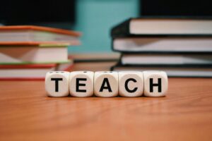TEACH spelled out with letter blocks
