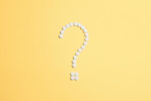 Question make made of white dots on yellow background
