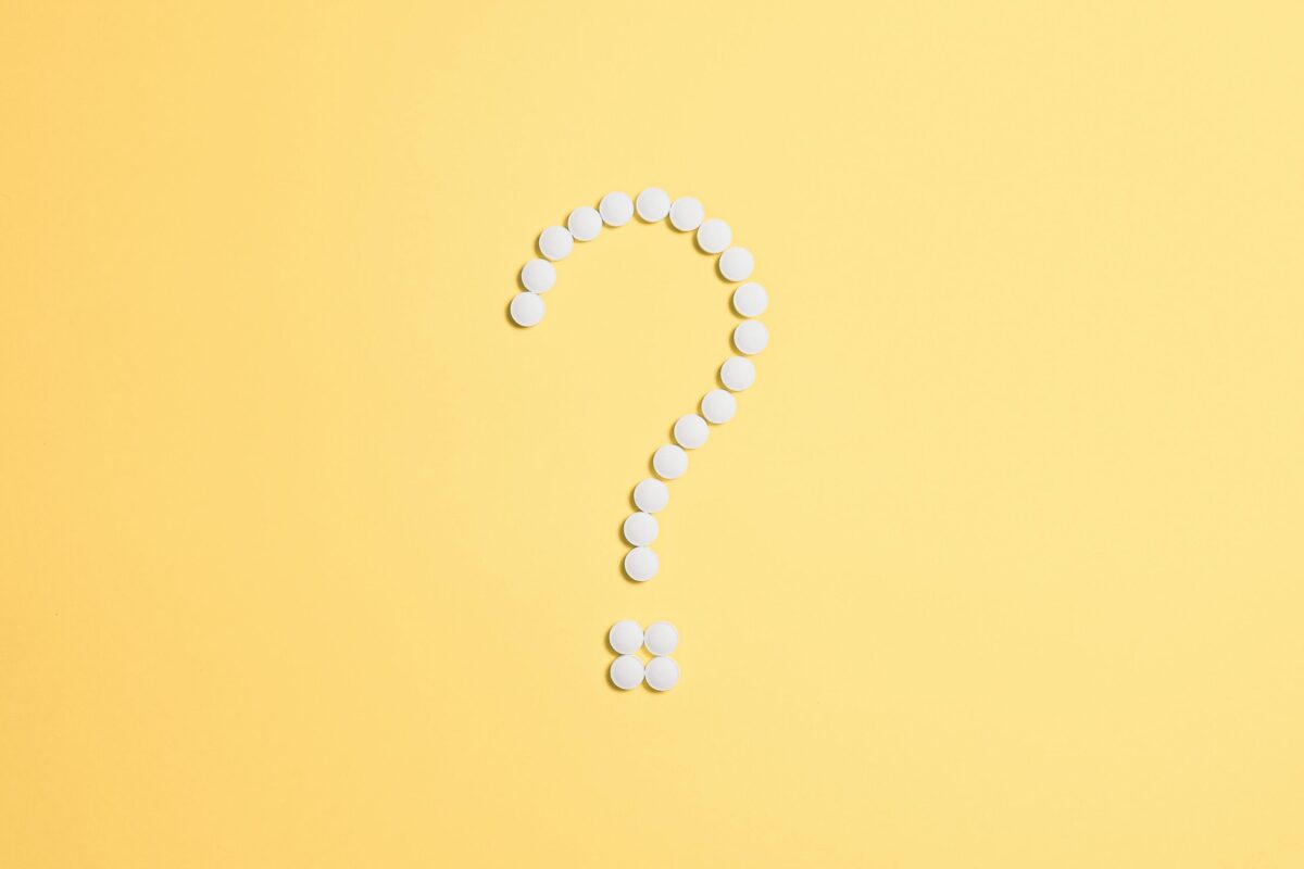 Question make made of white dots on yellow background